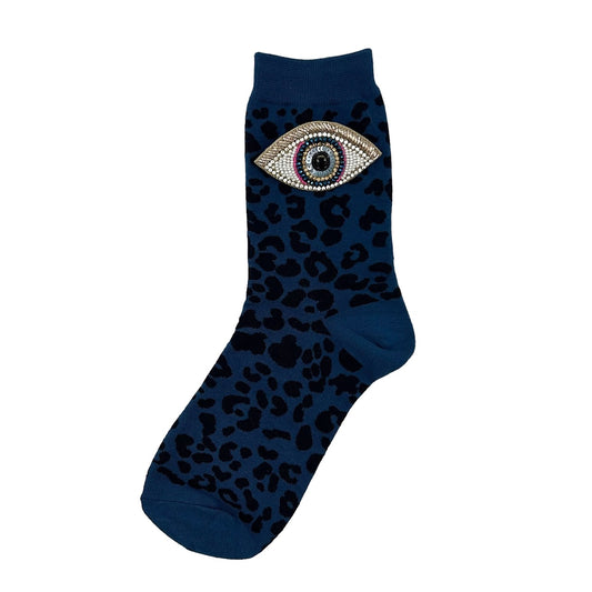 Leopard socks in denim with a golden eyes brooch