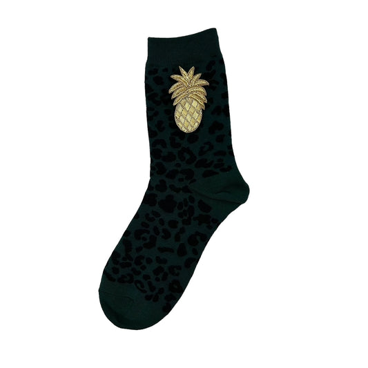 Leopard socks in teal with a golden pineapple brooch