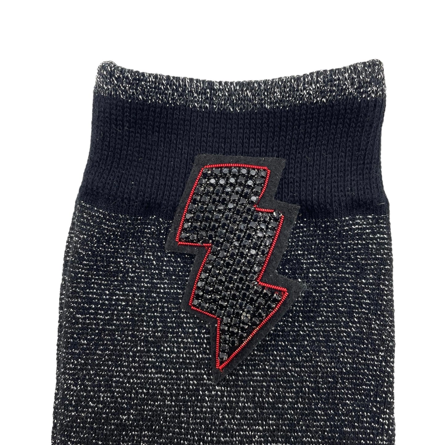 Tokyo socks in black with a large beaded lightning bolt pin