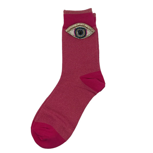 Tokyo socks in bright pink with a golden eyes brooch